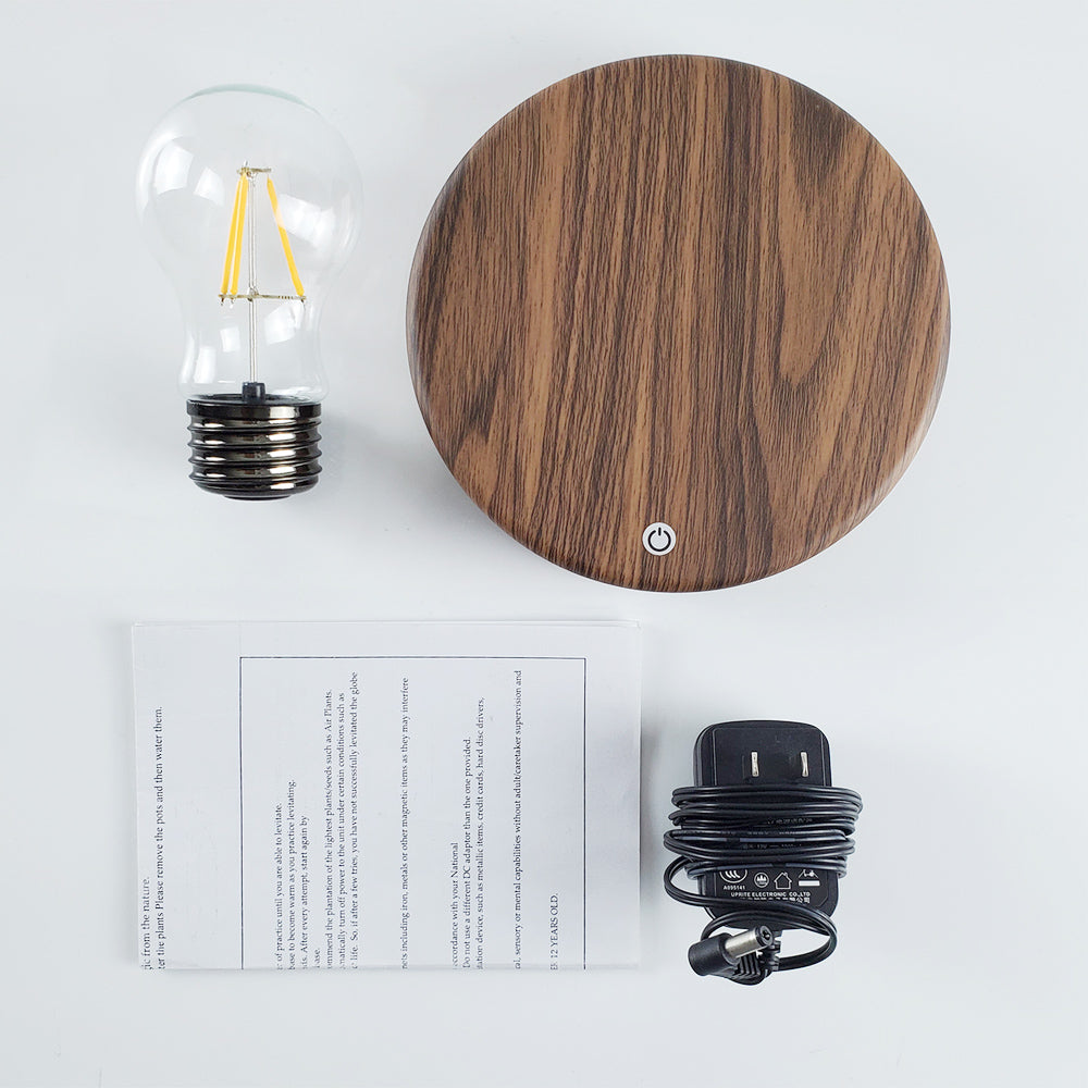 package including: bulb, wood base, charger and instructions